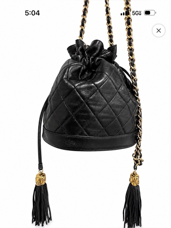 CHANEL Handbags - CHANEL Black Quilted Leather Bucket Bag with Gold Chain & Tassels